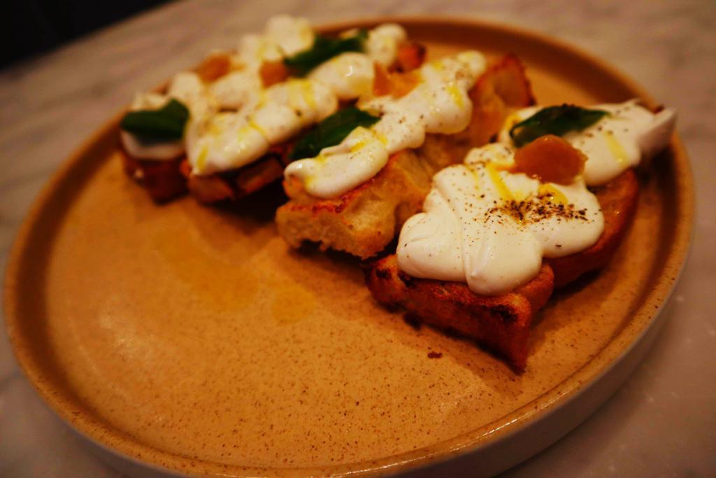Whipped Ricotta Crostini · Charred bread, whipped ricotta and confit garlic 