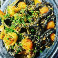 Black Squid Ink Fruti di  Mare  · Calamari, Tiger Shrimp, Cherry Tomatoes and spicy Panko bread crumbs.