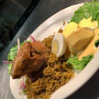 Arroz con Pollo Specialty Plate · Peruvian marinated chicken, cilantro rice mixed with green vegetables and salsa criolla, and...