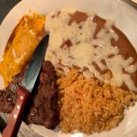17. Top Sirloin & Cheese Enchilada Rice and Beans Specialty Plate · 8 oz. steak served with a choice red or green sauce enchilada filled with cheese. Choice of ...