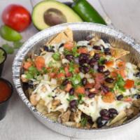 Shredded Chicken Nachos · A bed of chips with rice, pinto or black beans, cheese, lettuce, tomato, onion, cilantro & c...