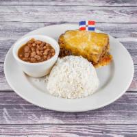 Pastelon Platano Maduro · Mashed yellow plantain smash into a pie stuffed with ground beef. Served with arroz blanco c...