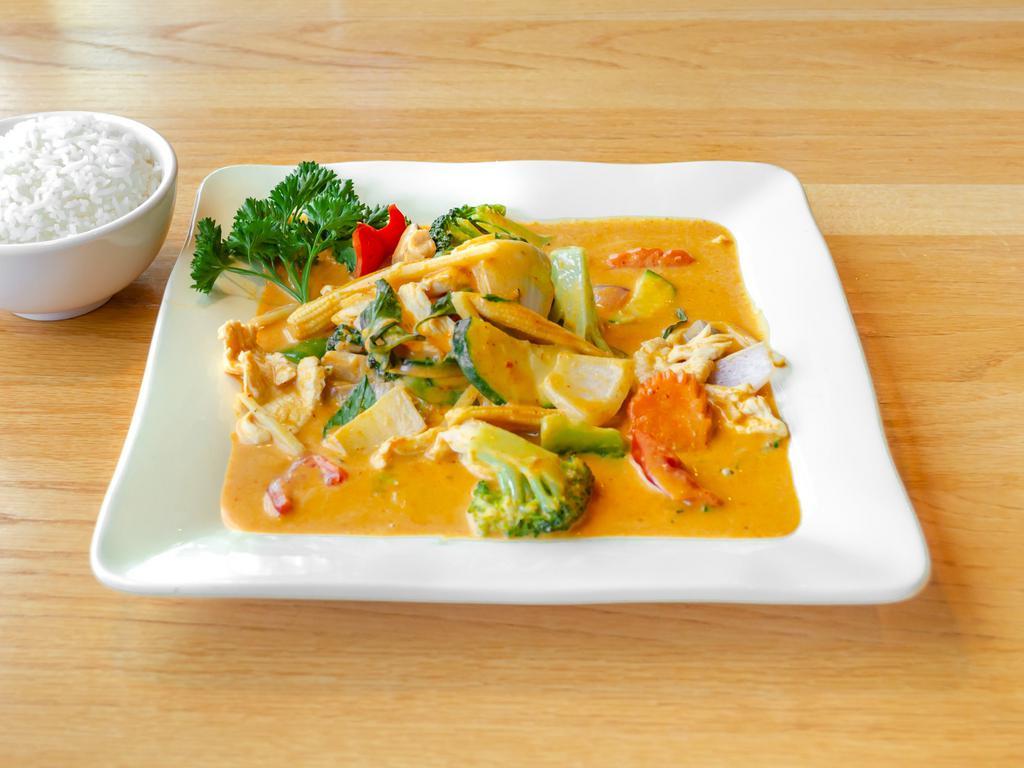 Red Curry  · Broccoli, bamboo shots, carrots, baby corn, mushrooms, zucchini, bell peppers, onions sauteed in a sweet curry sauce and fresh basil leaves.