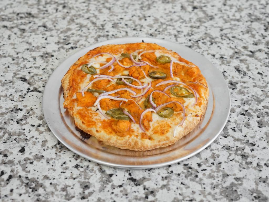 Spicy Butter Chicken Pizza · Butter chicken sauce, shredded mozzarella cheese, sliced red onions, jalapenos and butter chicken.