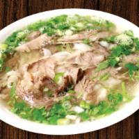 Pho Chin · Well-done flank and brisket beef noodle soup.