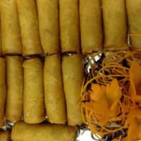 A1. 4 Piece Spring Rolls · Crispy spring rolls stuffed with assorted vegetables, vermicelli and cabbage served with chi...