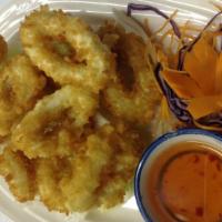 A12. Fried Calamari · Lightly battered and fried calamari served with sweet chili sauce.