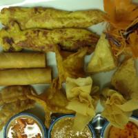 A16. Appetizer Platter · Combination of two spring rolls, two crab rangoons, one chicken satay, two tofu triangles, t...
