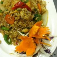 FR2. Basil Fried Rice · Fried rice with egg, chili paste, onions and bell peppers. Topped with scallions. Spicy.