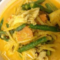 C1. Red Curry · Red chili curry with coconut milk, bamboo shoots, bell peppers, basil leaves, carrots and eg...