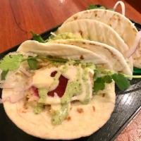 Original fish tacos (ahi tuna) · Crusted tuna, avocado, onions, cilantro/habanero aioli. 3 tacos.    ** gluten free option no...