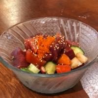 Rainbow Poke · Diced fish, cucumber, onions and seaweed with chili-sesame dressing.