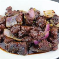 Black Pepper Beef Mignon · Chunks of tender beef wok-tossed with onions in a rich roasted black pepper sauce. Hot and s...