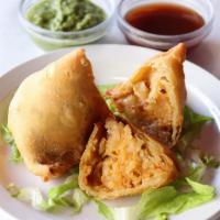 Vegetable Samosa · 2 pieces. Vegetarian turnovers stuffed with potatoes, peas and mild spices.