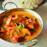 Butter Chicken · Chicken cooked in butter, sauce and herbs.