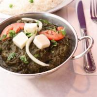 Saag Paneer · Pureed spinach leaves and cubes of paneer (homemade Indian cheese).