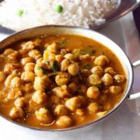 Channa Masala · Garbanzo beans spiced with fresh ginger and served in its own sauce. Served with complementa...