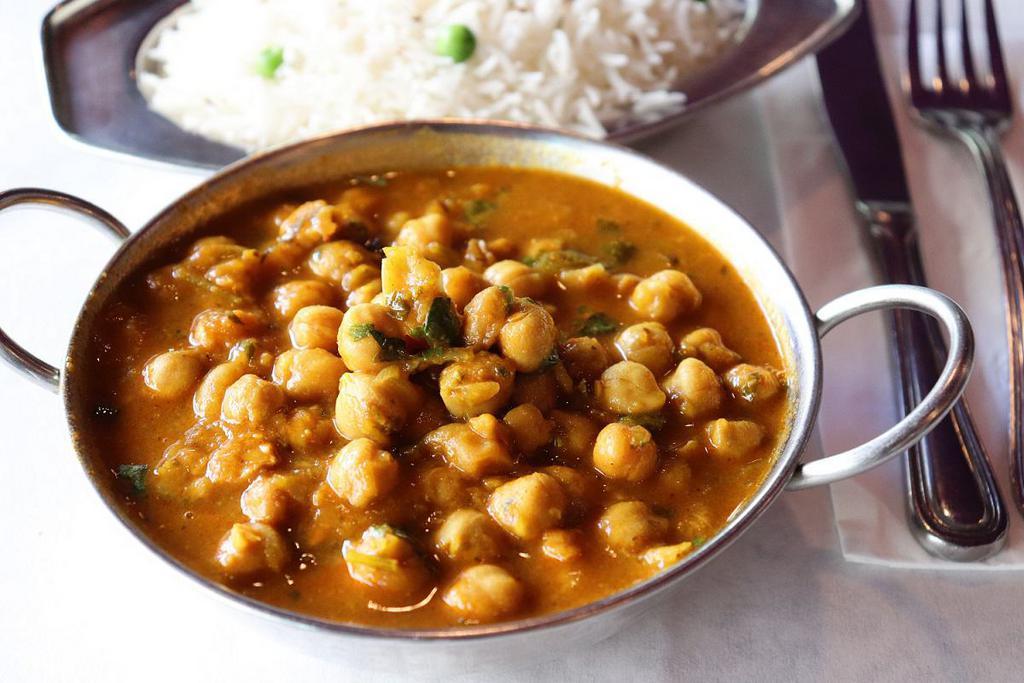 Channa Masala · Garbanzo beans spiced with fresh ginger and served in its own sauce. Served with complementary rice.
