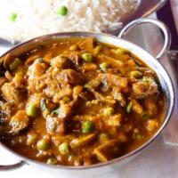 Mushroom Masala · Mushrooms and green peas with tomatoes, onion gravy and creamy curry. Served with complement...
