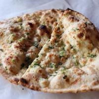 Garlic Naan · Topped with garlic and cilantro.