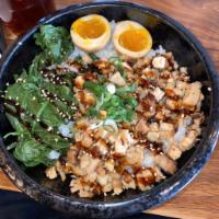 Pork Chashu Bowl · Slow-braised pork chashu, spinach, green onion, seasoned egg, sesame seeds.