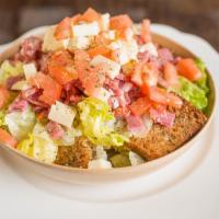 Friselle Salad · Our famous Italian whole wheat friselle, fresh cut lettuce, top with Volpi salami, hot capic...