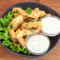 Super Calamari Steak Strips · Tender, large squid steaks cut in-house and made to order with homemade tequila lime aioli a...