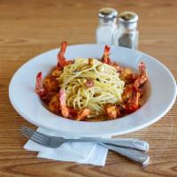 Shrimp al Filletto · We delicately butterfly the shrimp and immerse it in a sauce of fresh garlic, wine and our m...