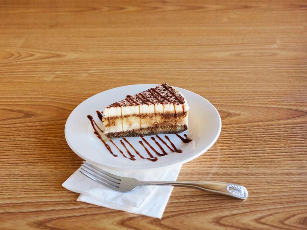 Tiramisu · Sponge cake soaked a tiramisu flavored sauce and layered with cream and mascarpone cheese then finished with a dusting of cocoa.