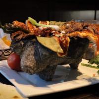 Chante Molcaxitl · Grilled chicken, steak, chorizo, shrimp, jalapeno pepper, nopal (Mexican cactus), cheese ser...