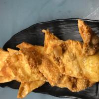 Crab Rangoon  · Deep fried wonton skins filled with cream cheese, crab meat and celery.