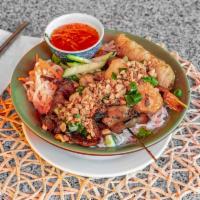 Bun Dac Biet Dinner · Tamarind tree noodles. Combination of skewered grilled pork and chicken, deep-fried egg roll...