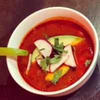 Pozole De Pollo · Mexican chiles- tomato chicken broth, with homony, tomatoes, peppers, onions, topped  with  ...