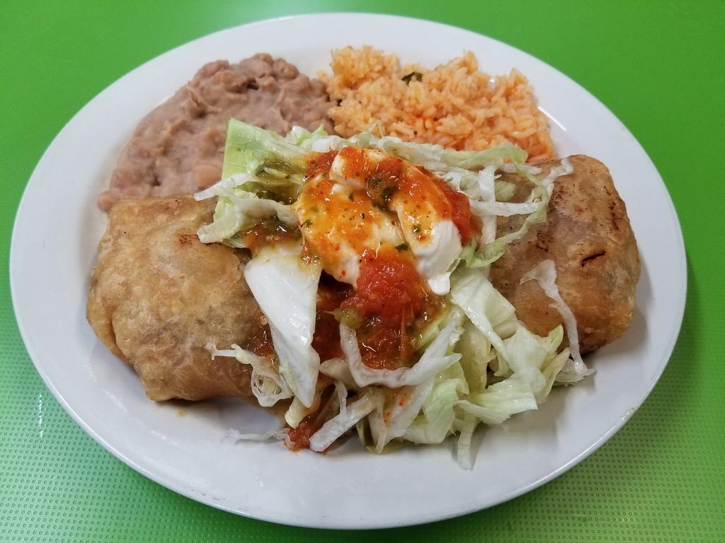Combo 7 · Chimichanga plate. Chimichanga is made with shredded beef or chicken grilled bell peppers, onions and Jack and cheddar cheese. Topped with lettuce and sour cream. Served with rice and beans on the side.