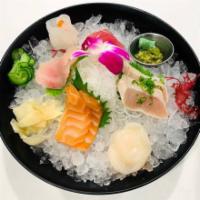 Sashimi Sampler · 2 pieces of salmon toro belly, 2 pieces of yellowtail toro belly, and 2 toro. Served with Ki...