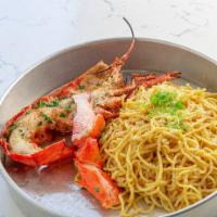Lobster Garlic Noodles · Chopped Lobster in Garlic & White Wine Sauce on Top of
Garlic Noodles