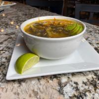 Tortilla Soup · Homemade chicken broth with shredded chicken. Topped with shredded cheese, tortilla strips, ...