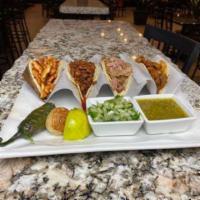 4 Mexican Street Tacos · Corn mini tortillas, served with your choice of grilled steak, grilled chicken, carnitas, ch...