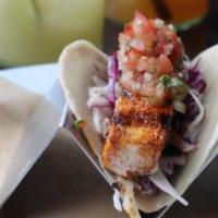 Baja Taco · Blackened mahi mahi, cabbage, lime crema and pico de gallo.