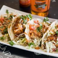 Taco Plate  · Two tacos topped with onion, tomato, cilantro and cabbage on warm corn tortillas. Served wit...