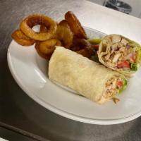 Chicken Shawarma Wrap · Marinated slices of chicken wrapped in fresh pita bread with lettuce, pickles and garlic sau...