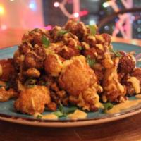 Rocoto Buffalo Cauliflower  · Fried cauliflower tossed in a spicy Peruvian style Buffalo sauce and served with a side of c...