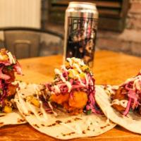 Baja fried fish tacos · 3 soft flour tortillas, battered white fish, garnished with purple cilantro cabbage, charred...