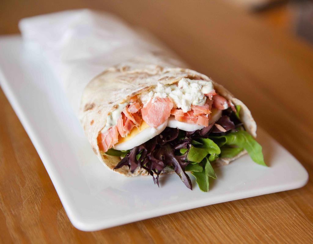 Salmon Wrap · Smoked salmon, slices of hard-boiled egg and cucumber on a bed of arugula topped with chevre and our house made dill sauce wrapped in our house-made lefse, a Norwegian potato-based flat-bread.