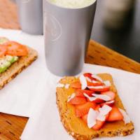 Nut Butter Toast · 1 slice of almond butter or peanut butter on toast with fresh fruit.  100% whole wheat - Dav...