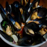 Steamed Mussels · Fresh mussels steamed with onions, tomatoes and garlic in a marinara, a fra diavolo or a whi...