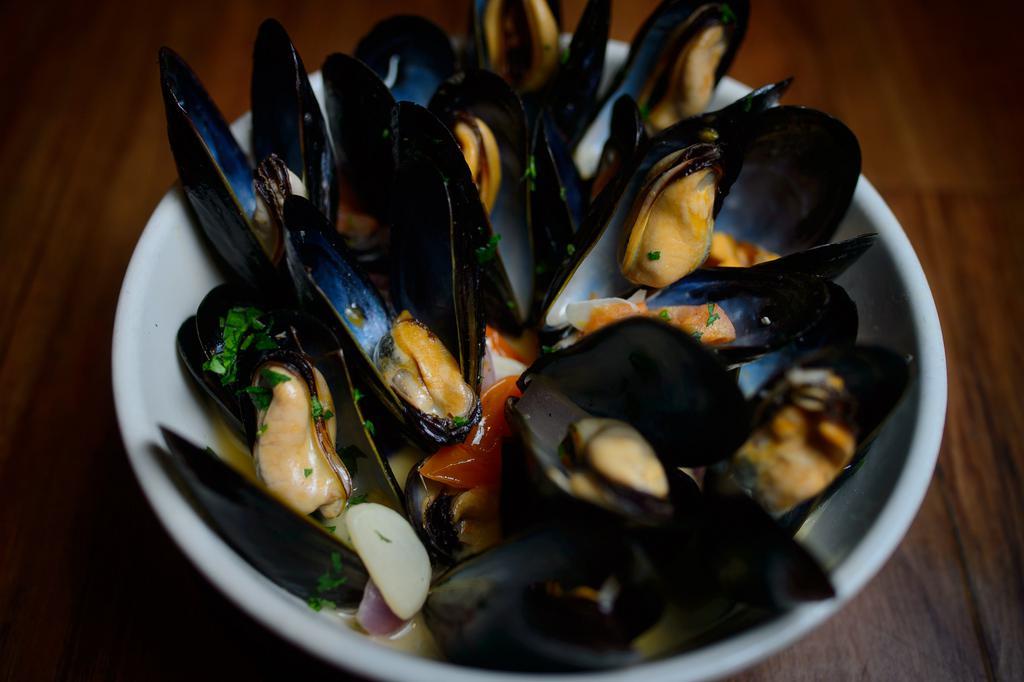 Steamed Mussels · Fresh mussels steamed with onions, tomatoes and garlic in a marinara, a fra diavolo or a white wine butter broth.