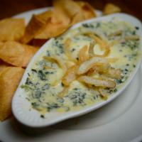 Spinach & Artichoke Dip · A creamy mixture of chopped spinach, Parmesan and artichoke hearts topped with mozzarella ch...