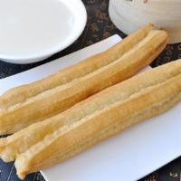 #02. Fried Bread Stick · Baked bread that has been flavored with cheese.
