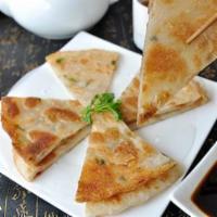 #03. Scallion Pancake · Savory folded flatbread. 